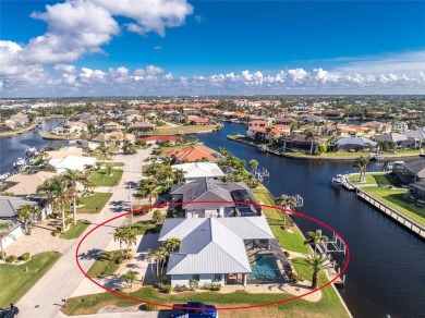 WATERFRONT pool home in Punta Gorda Isles, with intersecting on Saint Andrews South Golf Club in Florida - for sale on GolfHomes.com, golf home, golf lot