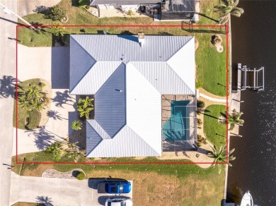 WATERFRONT pool home in Punta Gorda Isles, with intersecting on Saint Andrews South Golf Club in Florida - for sale on GolfHomes.com, golf home, golf lot