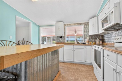 Come home to your beach getaway. This two bedroom, two flex on Oyster Bay Golf Links in North Carolina - for sale on GolfHomes.com, golf home, golf lot