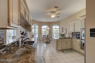 Beautifully turnkey furnished pool home located within the on Spruce Creek Golf Club in Florida - for sale on GolfHomes.com, golf home, golf lot