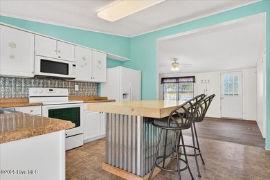 Come home to your beach getaway. This two bedroom, two flex on Oyster Bay Golf Links in North Carolina - for sale on GolfHomes.com, golf home, golf lot