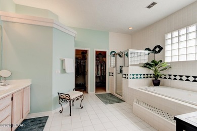 Beautifully turnkey furnished pool home located within the on Spruce Creek Golf Club in Florida - for sale on GolfHomes.com, golf home, golf lot