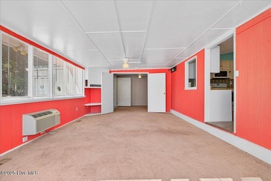 Come home to your beach getaway. This two bedroom, two flex on Oyster Bay Golf Links in North Carolina - for sale on GolfHomes.com, golf home, golf lot