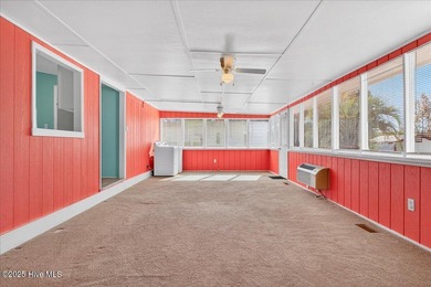 Come home to your beach getaway. This two bedroom, two flex on Oyster Bay Golf Links in North Carolina - for sale on GolfHomes.com, golf home, golf lot