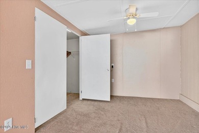 Come home to your beach getaway. This two bedroom, two flex on Oyster Bay Golf Links in North Carolina - for sale on GolfHomes.com, golf home, golf lot