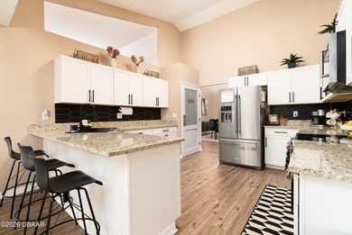 Welcome to this beautifully updated 4-bedroom, 3-bath pool home on The Club At Pelican Bay - North Course in Florida - for sale on GolfHomes.com, golf home, golf lot