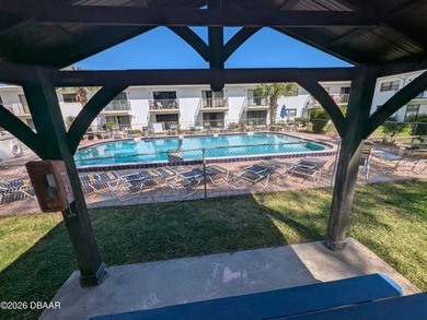 Step out your back door into the refreshing pool. Move in ready on Daytona Beach Golf Club in Florida - for sale on GolfHomes.com, golf home, golf lot