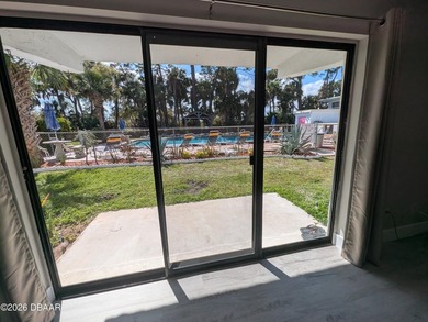 Step out your back door into the refreshing pool. Move in ready on Daytona Beach Golf Club in Florida - for sale on GolfHomes.com, golf home, golf lot