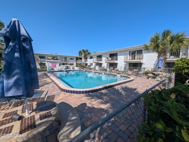 Step out your back door into the refreshing pool. Move in ready on Daytona Beach Golf Club in Florida - for sale on GolfHomes.com, golf home, golf lot
