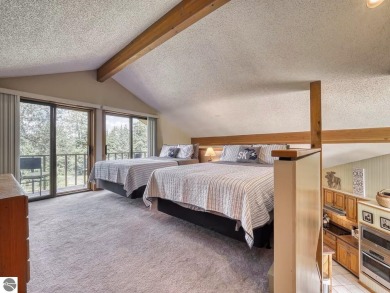Escape to this charming condo, perfectly situated to take in on Schuss Mountain Golf Club in Michigan - for sale on GolfHomes.com, golf home, golf lot