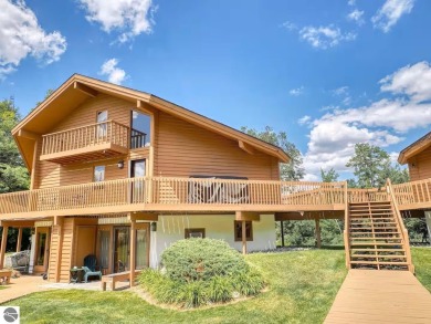 Escape to this charming condo, perfectly situated to take in on Schuss Mountain Golf Club in Michigan - for sale on GolfHomes.com, golf home, golf lot