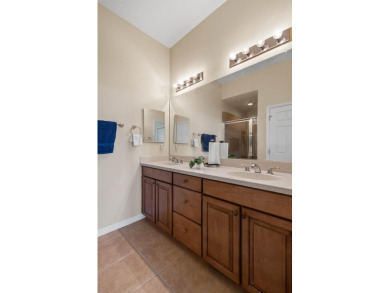 This lovely home boasts 2 master suites both overlooking on Scepter Golf Club in Florida - for sale on GolfHomes.com, golf home, golf lot
