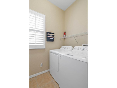 This lovely home boasts 2 master suites both overlooking on Scepter Golf Club in Florida - for sale on GolfHomes.com, golf home, golf lot
