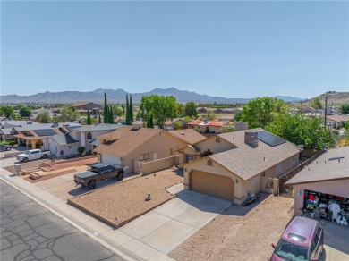 Charming 3 bed, 2 bath home built in 2001 with vaulted ceilings on Cerbat Cliffs Golf Course in Arizona - for sale on GolfHomes.com, golf home, golf lot