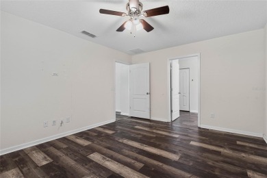 Welcome to this meticulously maintained 4-bedroom, 2-bath on Grand Reserve Golf Course in Florida - for sale on GolfHomes.com, golf home, golf lot