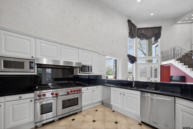 Nestled on a rare, sprawling one-acre, corner lot overlooking on Hollytree Country Club in Texas - for sale on GolfHomes.com, golf home, golf lot