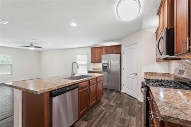 Welcome to this meticulously maintained 4-bedroom, 2-bath on Grand Reserve Golf Course in Florida - for sale on GolfHomes.com, golf home, golf lot
