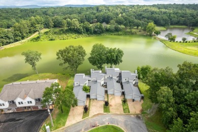 Vista View across a large pond with a fairway beyond. One of on Diamondhead Golf and Country Club in Arkansas - for sale on GolfHomes.com, golf home, golf lot