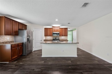 Welcome to this meticulously maintained 4-bedroom, 2-bath on Grand Reserve Golf Course in Florida - for sale on GolfHomes.com, golf home, golf lot