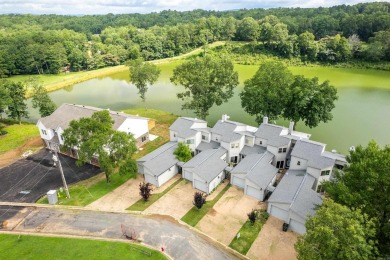 Vista View across a large pond with a fairway beyond. One of on Diamondhead Golf and Country Club in Arkansas - for sale on GolfHomes.com, golf home, golf lot
