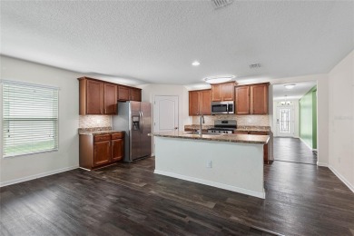 Welcome to this meticulously maintained 4-bedroom, 2-bath on Grand Reserve Golf Course in Florida - for sale on GolfHomes.com, golf home, golf lot