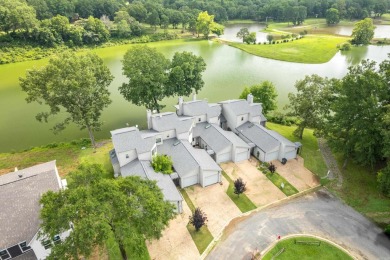 Vista View across a large pond with a fairway beyond. One of on Diamondhead Golf and Country Club in Arkansas - for sale on GolfHomes.com, golf home, golf lot