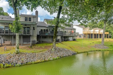 Vista View across a large pond with a fairway beyond. One of on Diamondhead Golf and Country Club in Arkansas - for sale on GolfHomes.com, golf home, golf lot