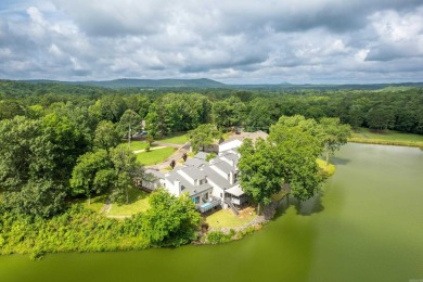 Vista View across a large pond with a fairway beyond. One of on Diamondhead Golf and Country Club in Arkansas - for sale on GolfHomes.com, golf home, golf lot