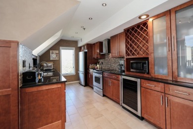 Penthouse living at its finest! This rare two-story home on the on Sky Meadow Country Club in New Hampshire - for sale on GolfHomes.com, golf home, golf lot