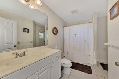 Appealing three bedroom, plus den, two bath, pool home in on Mission Valley Country Club in Florida - for sale on GolfHomes.com, golf home, golf lot