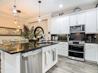 Pool home Alert! Welcome to paradise in this sought-after Key on LPGA International Golf Course in Florida - for sale on GolfHomes.com, golf home, golf lot