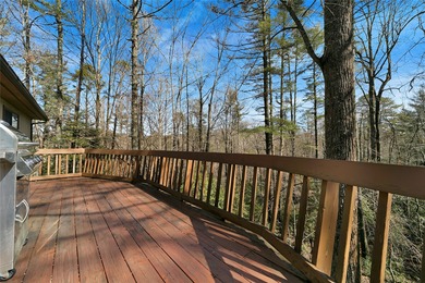 Nestled on 2.3 private wooded acres in the highly sought-after on Connestee Falls Golf Club in North Carolina - for sale on GolfHomes.com, golf home, golf lot