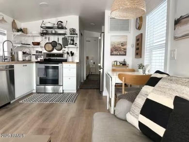 Nestled in a charming RV resort community in Mesa, this 1-bed on Apache Wells Country Club in Arizona - for sale on GolfHomes.com, golf home, golf lot