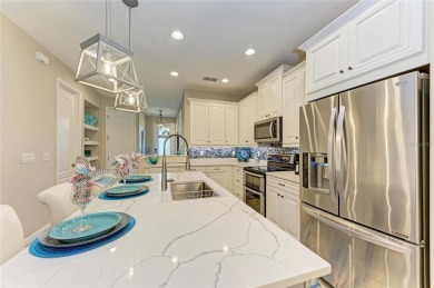 Absolutely stunning and very well-maintained townhouse at on Esplanade Golf and Country at Lakewood Ranch in Florida - for sale on GolfHomes.com, golf home, golf lot