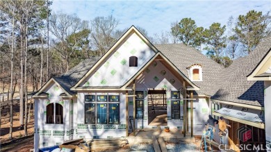 Introducing a New Construction luxurious custom home nestled in on Reynolds Lake Oconee - The Oconee in Georgia - for sale on GolfHomes.com, golf home, golf lot