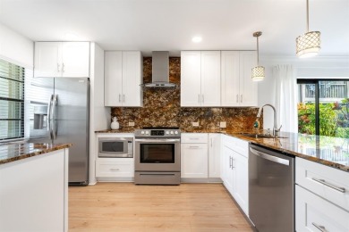 Experience effortless living in this light-filled first-floor on Boca Lago Golf and Country Club in Florida - for sale on GolfHomes.com, golf home, golf lot