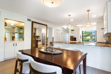 Experience effortless living in this light-filled first-floor on Boca Lago Golf and Country Club in Florida - for sale on GolfHomes.com, golf home, golf lot