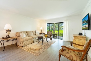 Experience effortless living in this light-filled first-floor on Boca Lago Golf and Country Club in Florida - for sale on GolfHomes.com, golf home, golf lot