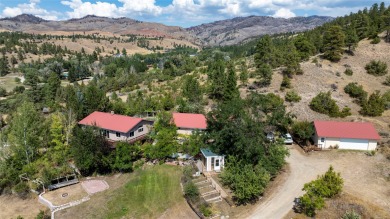 An oasis on the hill overlooks the lush climbing landscapes of on Norwegian Wood Golf Course in Montana - for sale on GolfHomes.com, golf home, golf lot