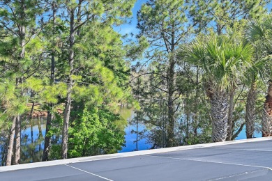 Beautiful custom home overlooking the lake in exclusive gated on Regatta Bay Golf and Country Club in Florida - for sale on GolfHomes.com, golf home, golf lot