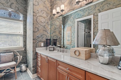 Beautiful custom home overlooking the lake in exclusive gated on Regatta Bay Golf and Country Club in Florida - for sale on GolfHomes.com, golf home, golf lot