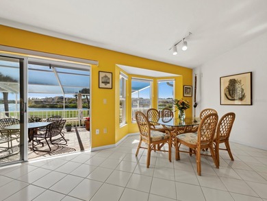Positioned along the par-5 fairway with tranquil lake views on Longboat Key Golf Club Resort in Florida - for sale on GolfHomes.com, golf home, golf lot