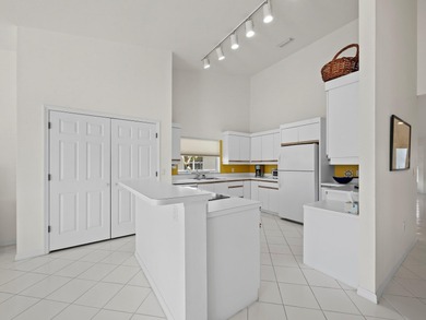 Positioned along the par-5 fairway with tranquil lake views on Longboat Key Golf Club Resort in Florida - for sale on GolfHomes.com, golf home, golf lot