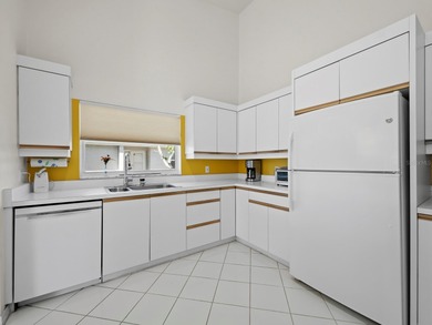 Positioned along the par-5 fairway with tranquil lake views on Longboat Key Golf Club Resort in Florida - for sale on GolfHomes.com, golf home, golf lot