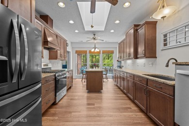 Step into this beautifully updated brick home tucked away in a on Harbour Point Golf Club in North Carolina - for sale on GolfHomes.com, golf home, golf lot