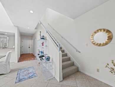 Bathed in natural light, this 2BR, 2.5BA townhome in Fairway Bay on Longboat Key Golf Club Resort in Florida - for sale on GolfHomes.com, golf home, golf lot