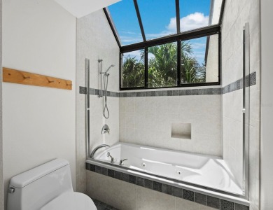 Bathed in natural light, this 2BR, 2.5BA townhome in Fairway Bay on Longboat Key Golf Club Resort in Florida - for sale on GolfHomes.com, golf home, golf lot