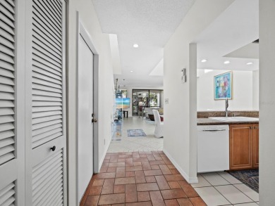 Bathed in natural light, this 2BR, 2.5BA townhome in Fairway Bay on Longboat Key Golf Club Resort in Florida - for sale on GolfHomes.com, golf home, golf lot