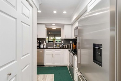 Enjoy peaceful unobstructed views of the lake and golf course on Palm Aire Country Club of Sarasota in Florida - for sale on GolfHomes.com, golf home, golf lot