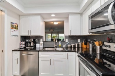 Enjoy peaceful unobstructed views of the lake and golf course on Palm Aire Country Club of Sarasota in Florida - for sale on GolfHomes.com, golf home, golf lot